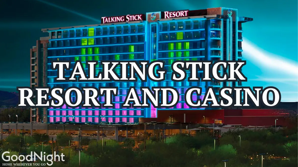 An illuminated hotel or resort facade at night featuring prominent signage and vibrant colorful lighting. The lively atmosphere hints at a resort-style experience with excitement and entertainment, showcasing the sort of destination guests might visit with their complimentary pool day pass.